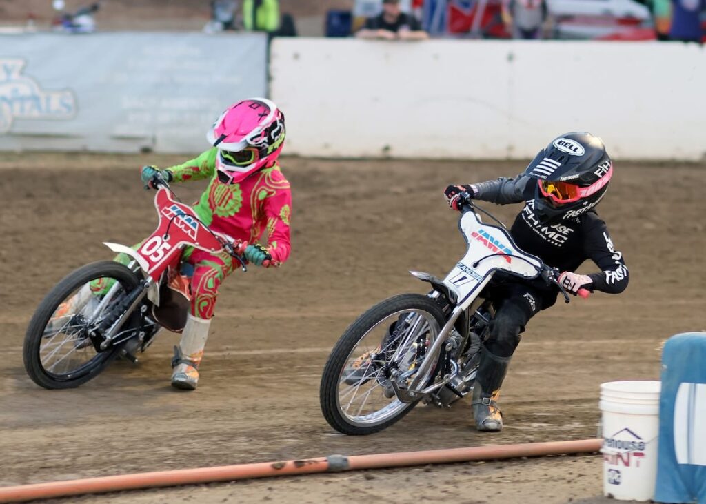 Riley Rearick (L) and Zander Schroeder race in a Youth 150 D1 heat race. Rearick won the Youth 150cc main event and Schroeder was second. May 23 2025 - Speedway & Extreme Sidecars Series Round 1.