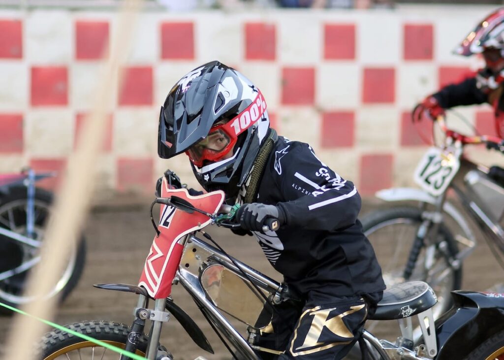 Young Mason Howell puts on his game face at the start line as he starts a Youth 150cc D2 heat race. Howell won the Youth 150cc D2 main event for the second time this season. May 30 2025 - More great racing at Fast Friday’s Motorcycle Speedway in Auburn CA.
