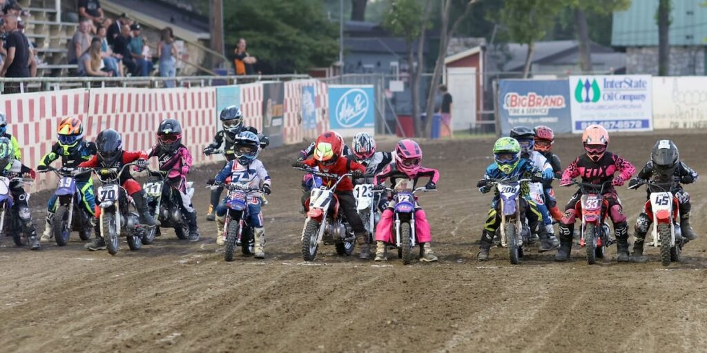 Wee-The Pee-Wee division riders line up for a heat race start. The pee-wees are always crowd favorite at Fast Fridays. May 30 2025 - More great racing at Fast Friday’s Motorcycle Speedway in Auburn CA.