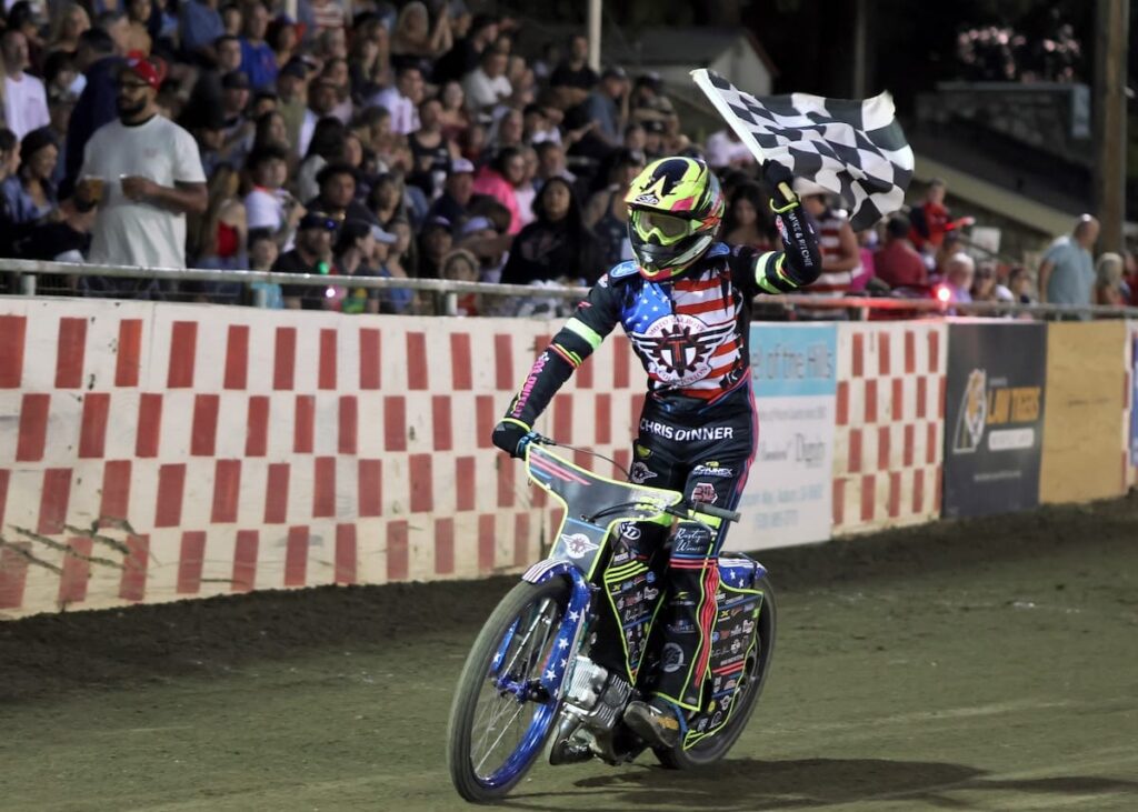 Alex Martin celebrates his scratch main event. Martin, in his first appearance at Fast Fridays this season, also won the handicap main event. July 4 2025 - Great 4th of July celebration and races.