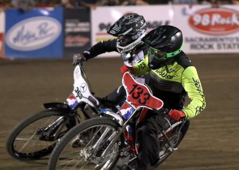 Brandon Hendrickson (133) passes on the inside. Hendrickson won the support main event, his first main event win of the season. Aug 8 2025 - Championship racing begins at Fast Friday’s Motorcycle Speedway in Auburn, CA.