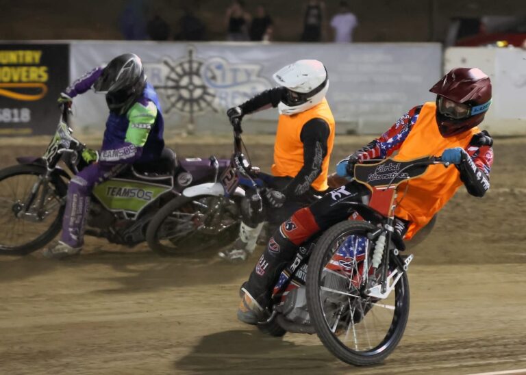 Racing in the Team Challenge championship (left-right) Sammy Tetrault, Cody Aker and Timmy Dion race for team points. The Law Tigers won this year's Team Challenge championship. Aug 8 2025 - Championship racing begins at Fast Friday’s Motorcycle Speedway in Auburn, CA.