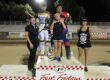 Broc Nicol (left back) and Greg Moore (back right) celebrate their wins Friday night, Nicol (the scratch main and Moore the handicap main) with Fast Friday's trophy girls (left-right) Kelly Craven, Lily Sneed and Leni Crow. Aug 8 2025 - Championship racing begins at Fast Friday’s Motorcycle Speedway in Auburn, CA.