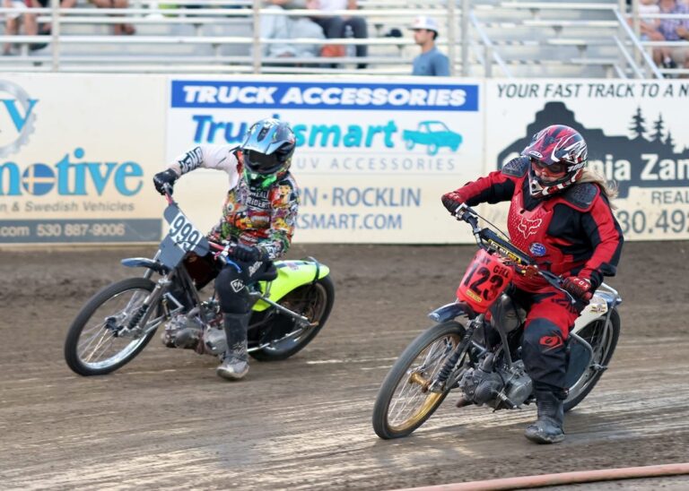 Leeann Emerson (right) is shown here in an early heat race with Hank Hanaway (left). Later in the evening Emerson made a gutsy inside move to win the Youth 150cc D2 main event with just feet from the finish line. July 25 2025 - Great racing is continuing at Fast Fridays in Auburn Ca.