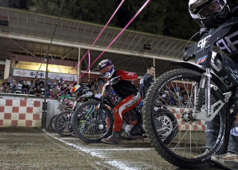 Greg Moore, (center) checks the tapes as a semi-final scratch race is set to go. July 25 2025 - Great racing is continuing at Fast Fridays in Auburn Ca.