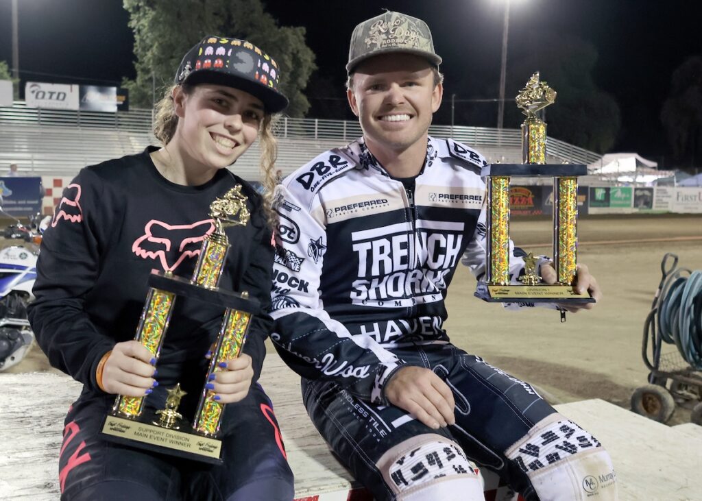 8006 Celebrating their wins Friday night are Catherine Moore (left) and Broc Nicol (right). Nicol won the scratch main event and Moore the Support D2 main event. May 22 2026 - Great opening night for Fast Friday’s Motorcycle Speedway in Auburn, CA.