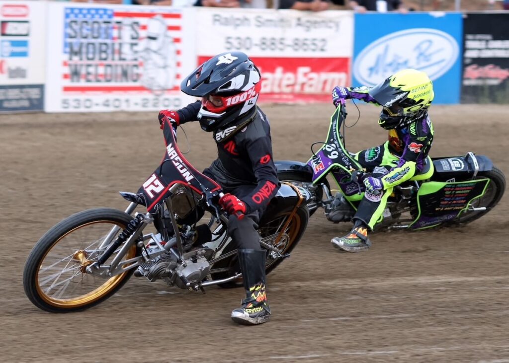 Mason Howell (left) and Liam Falcon (right) have a go at each other each week at Fast Fridays, tough competitors both. Howell won the Youth 150cc D1 main event this week, his fourth of the season. June 26 2026 - 2026 Speedway & Team Challenge Round #3.