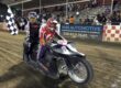 Wade Boyd and Joshua Bustos celebrate their sidecar main event win Friday night with a trip around the track with the checkered flag. June 5 2026 - 2026 Speedway & Extreme Sidecars Round #1.