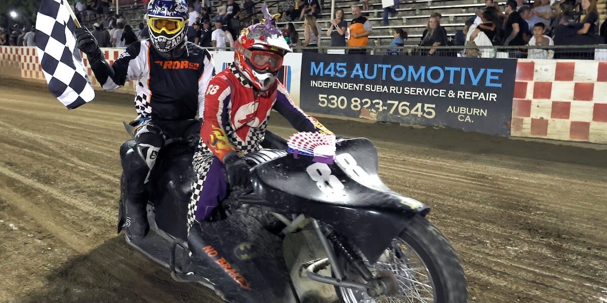 June 5 2026 – 2026 Speedway & Extreme Sidecars Round #1 – 8379 Boyd-Bustos Wade Boyd and Joshua Bustos celebrate their sidecar main event win Friday night with a trip around the track with the checkered flag. June 5 2026 - 2026 Speedway & Extreme Sidecars Round #1.