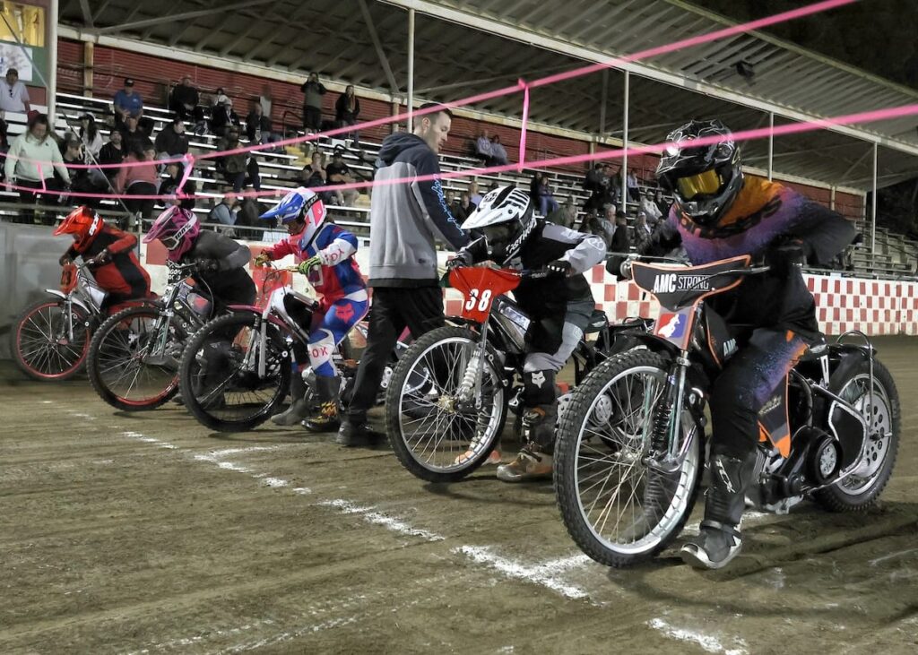 The start of the Youth 250cc D2 main event. Justin Gist (far right) riding out of lane one won the race. Gist won all his races including the main event. May 29 2026 - 2026 Speedway & Team Challenge Round #1.