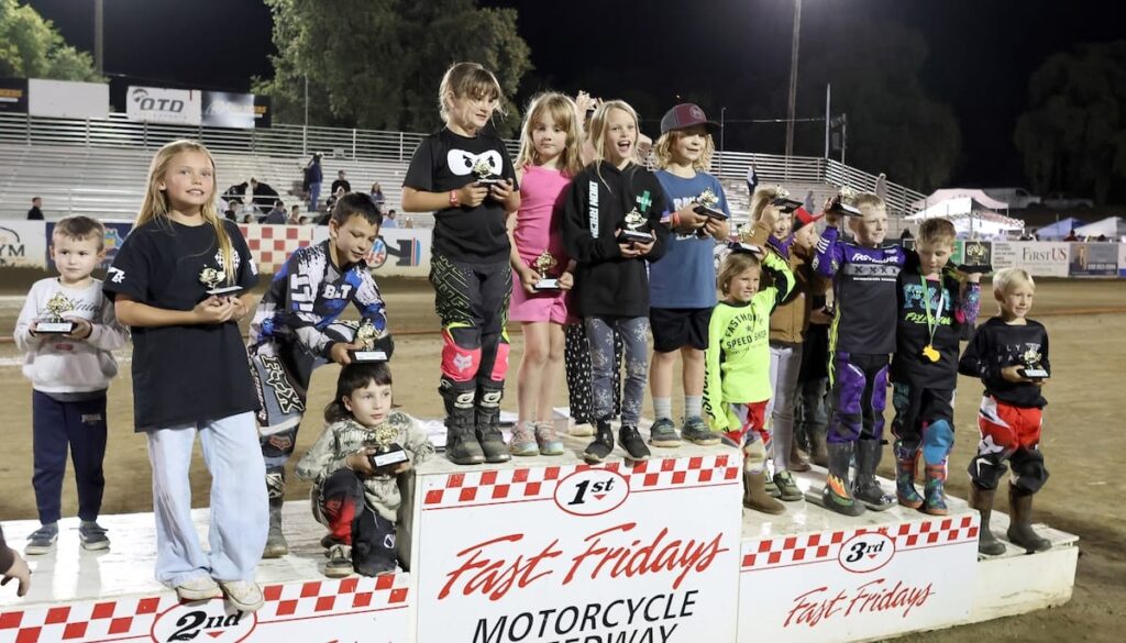 The pee-wees are always the first to make their way to the winners podium each week to accept their trophies. Smiles all around. May 29 2026 - 2026 Speedway & Team Challenge Round #1.