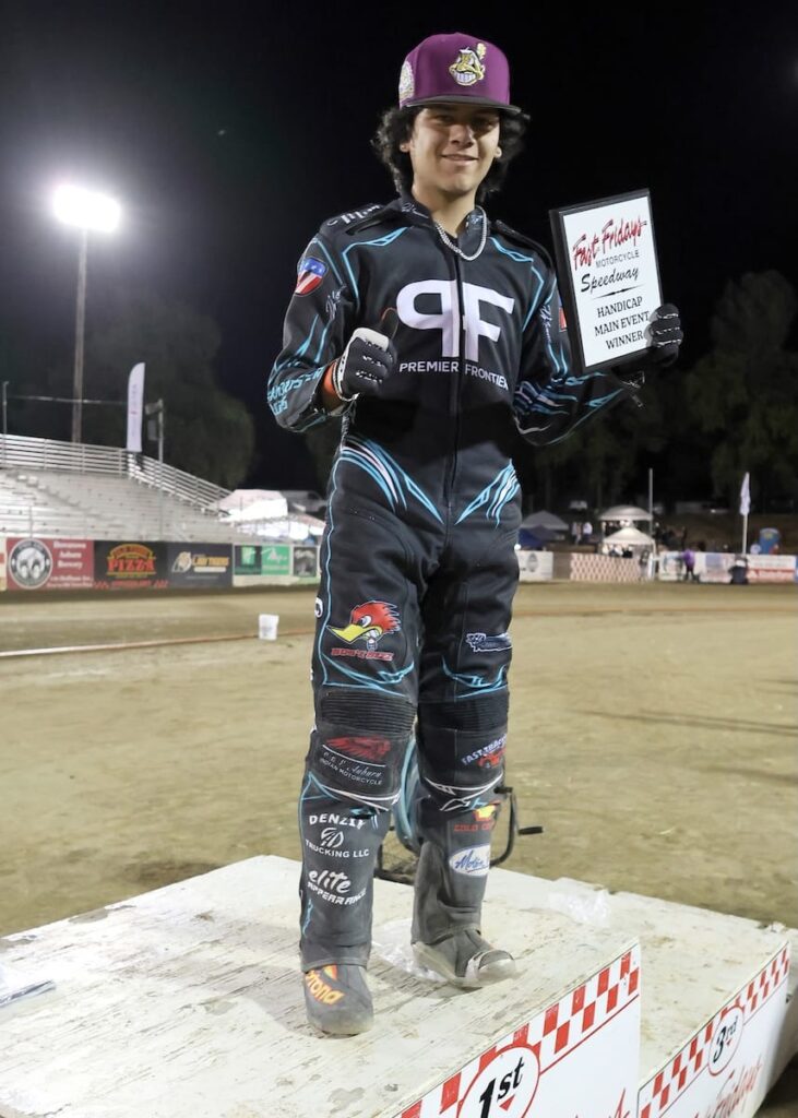 Darren Armbruster on the winner's podium Friday night after winning the handicap main event, his first main event win of the season. May 29 2026 - 2026 Speedway & Team Challenge Round #1.