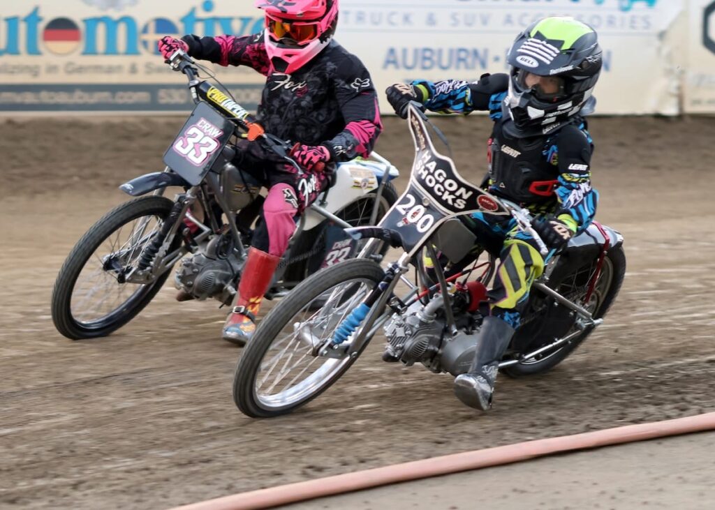 Kaiden Boyd-Bews (right) and Kaidence Craw (left) in a tight race. Boyd-Bews edged Craw out on the final laps to win the Youth 150cc D3 main event. Craw was second and William Bruce was third. July 10 2026 - 2026 Speedway & Team Challenge Round #4.