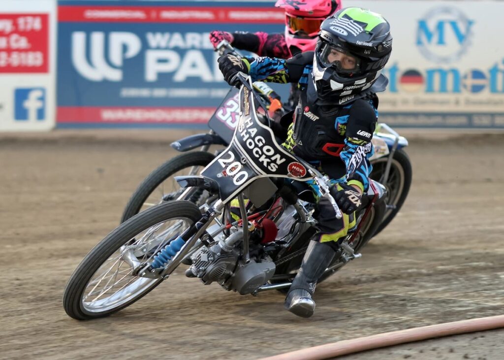 Kayden Boyd-Bews (200) passes Kaydence Craw (33) in the final turn to win the Youth 150cc D3 main event. July 17 2026 - 2026 Budweiser’s North vs. South Challenge.