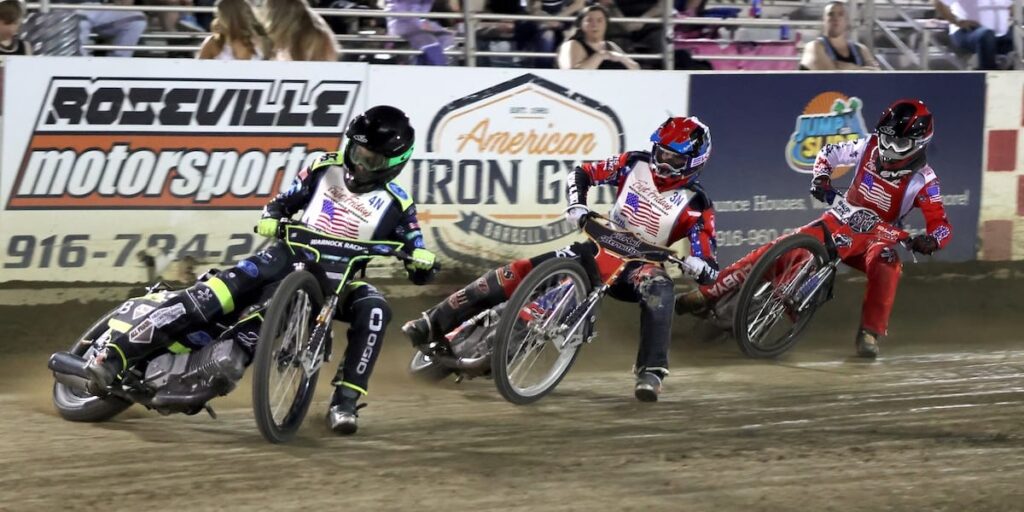 North rider Brady Landon leads teammate Timmy Dion and South rider Justin Almon in a heat race. Landon was the high scorer for the North scoring 19 points. July 17 2026 - 2026 Budweiser’s North vs. South Challenge.