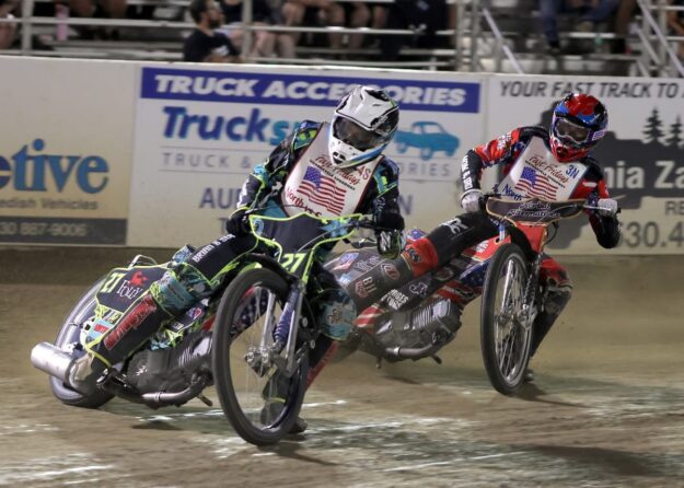 South rider Chris Kerr and North rider Timmy Dion are tight in a corner during a heat race. Extremely skilled riders on both teams rode just inches from each other during the North vs. South Challenge Friday night. July 17 2026 - 2026 Budweiser’s North vs. South Challenge.