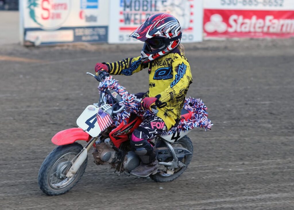 Many of the Pee-Wee's decorated their motorcycles for the Fourth of July celebration. Kennedy Latham rode in the Pee-Wee division on a decorated bike. July 4 2026 - 2026 Speedway & Extreme Sidecars Round #2.
