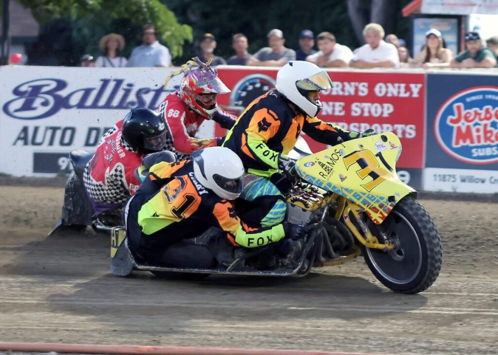 The Curry's, Robert and Laurie, on the track on the way to a heat race win Friday night. The Curry's won the Extreme Sidecar main event. July 4 2026 - 2026 Speedway & Extreme Sidecars Round #2.