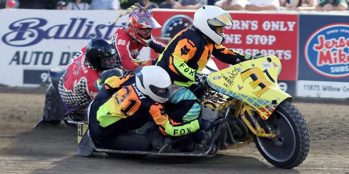 The Curry's, Robert and Laurie, on the track on the way to a heat race win Friday night. The Curry's won the Extreme Sidecar main event. July 4 2026 - 2026 Speedway & Extreme Sidecars Round #2.