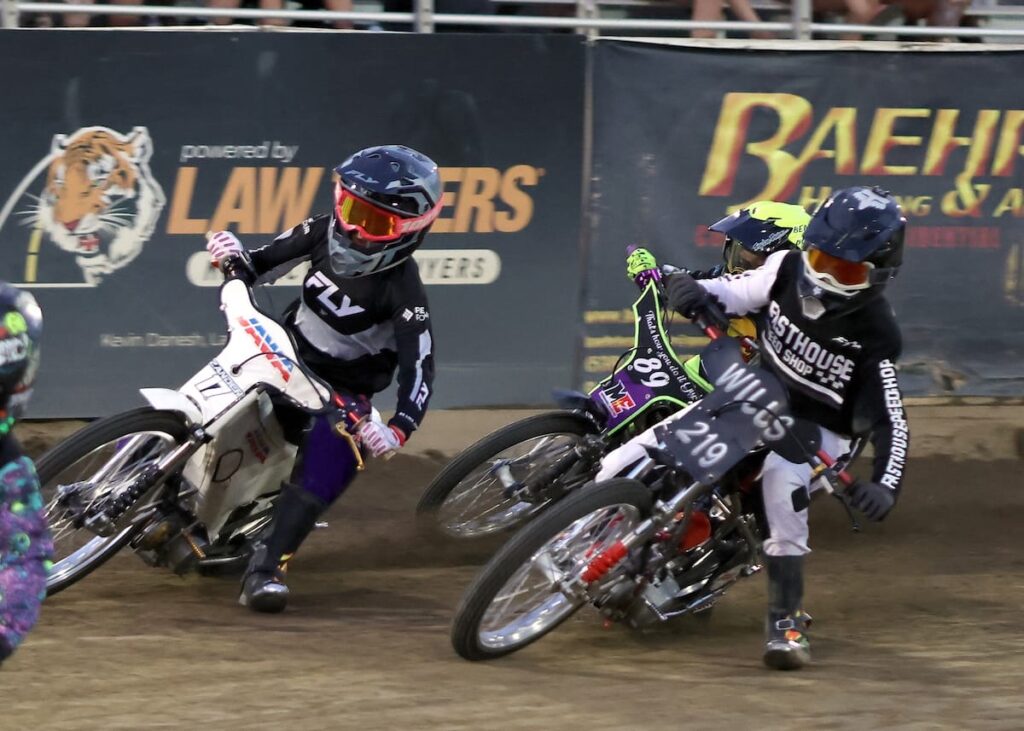 Brady Wills (right) won his first main event in the Youth 150cc D1 main event. Pictured here in a heat race with Zander Schroeder (left) and Liam Falcon (center). Aug 7 2026 - 2026 Speedway & Extreme Sidecars Round #3.