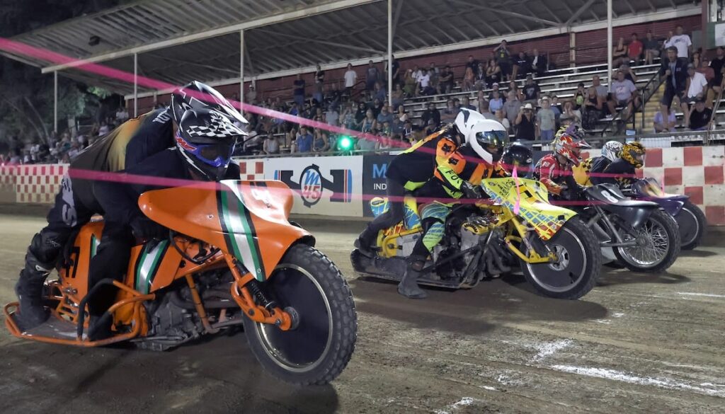 The start of the Extreme Sidecars main event. The team of Wade Boyd and Eric Lindauer (third from left) won the race. Aug 7 2026 - 2026 Speedway & Extreme Sidecars Round #3.