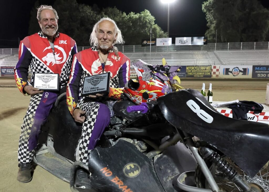 All smiles is the sidecar team of Wade Boyd (right) and Eric Lindauer (left) as they pose and receive their trophies for winning the Extreme Sidecar main event. Aug 7 2026 - 2026 Speedway & Extreme Sidecars Round #3.