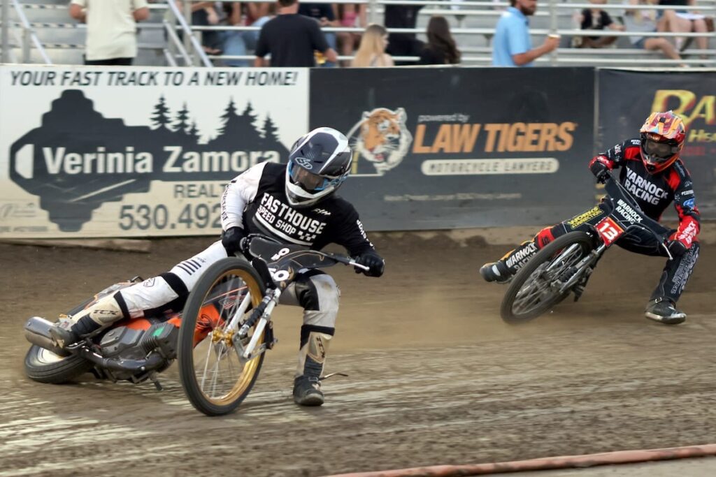 Wesley Rearick (left) and Jameson Hutchinson (right), both tough competitors, in a Youth 250cc D1 heat race. Hutchinson won the main event. July 31 2026 - 2026 Speedway & 25 Lap Main Event.