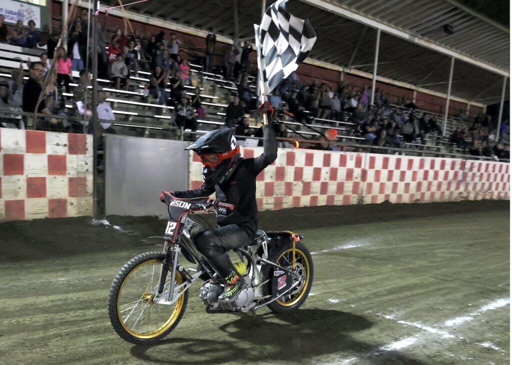 Mason Howell takes a victory after winning the AMA Youth 150cc National Championship. Sept 26 2026 - 2026 AMA Extreme Sidecar National Championship & Youth 250cc and 150cc Nationals.