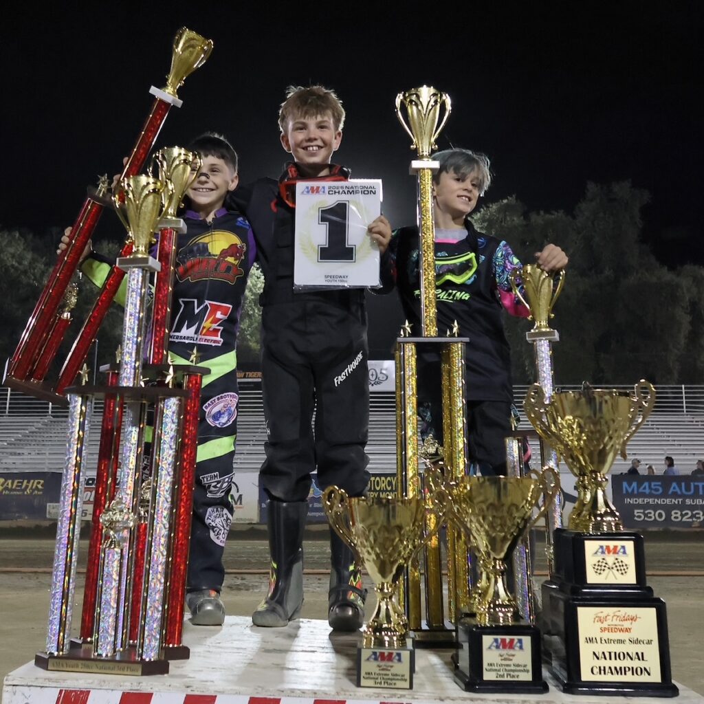 All smiles on the winner's podium the Youth 150cc champions first, second and third-place winners hold their trophies. Mason Howell-first place (center), Liam Falcon-second-place (left) and Logan Kerr-third-place (right). Sept 26 2026 - 2026 AMA Extreme Sidecar National Championship & Youth 250cc and 150cc Nationals.